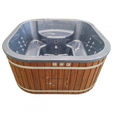 Square Scandinavian spa with built-in fireplace and water jets, perfect for a relaxing outdoor spa experience